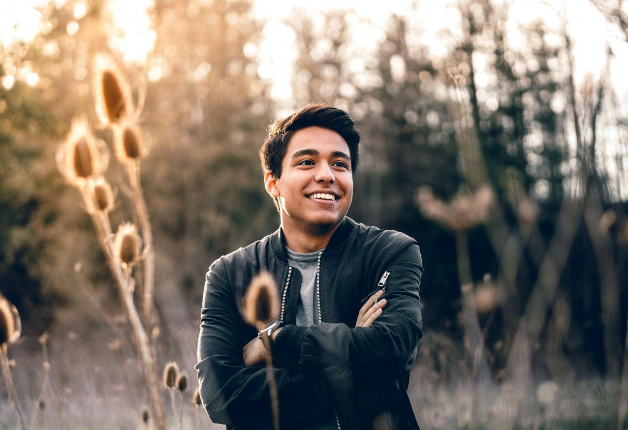 Man smiling among tall reeds